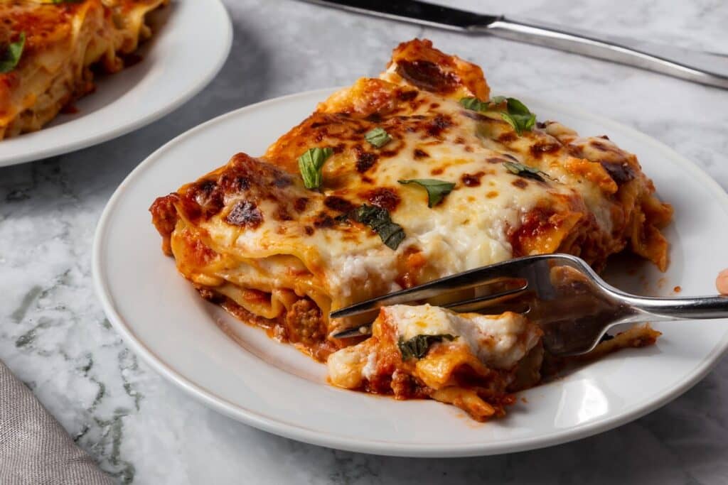 bolognese lasagna with fork